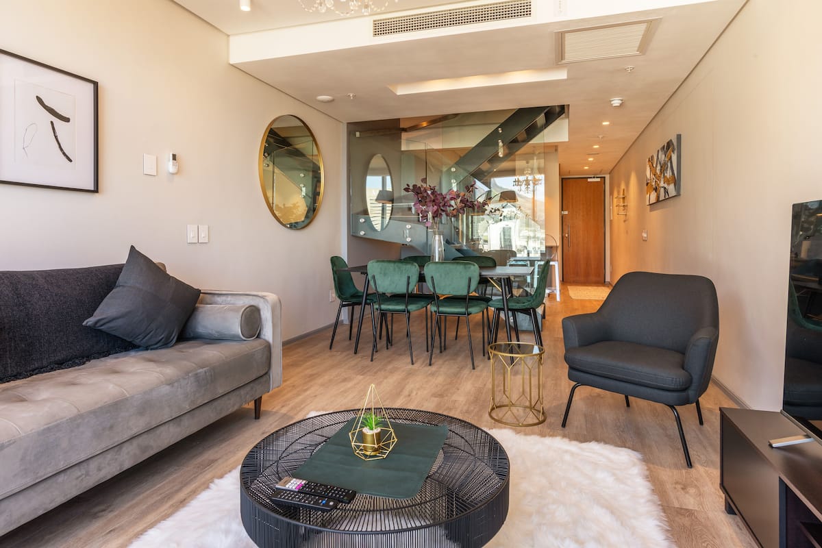 Presidential Penthouse, 2 Bedrooms, Kitchen, Mountain View | Living area | 55-inch Smart TV with cable channels, TV, Netflix