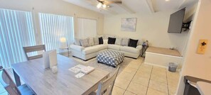 House, Multiple Beds, Kitchen, Pool View | Living area | TV - Atol Quad #1 (South Padre Island)