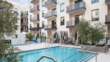 Outdoor pool, pool umbrellas, sun loungers