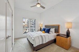 Desk, laptop workspace, iron/ironing board, bed sheets