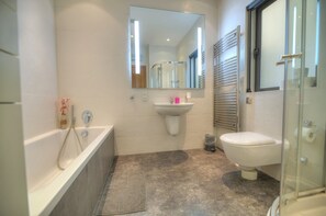 Bathtub, hair dryer, towels