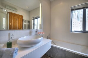 Bathtub, hair dryer, towels
