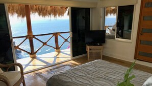 A bedroom with a bed, a TV, and a view of the ocean. - VillaParaisoAca,  With Beautiful View & Private Beach.  Christmas Special. (Acapulco)