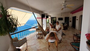 A room with a view of the ocean, a ceiling fan, and a hammock. - VillaParaisoAca,  With Beautiful View & Private Beach.  Christmas Special. (Acapulco)
