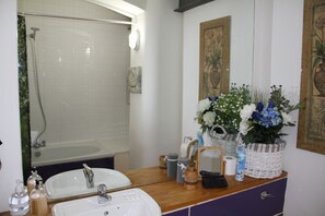 Apartment, Multiple Beds | Bathroom | Combined shower/tub, deep soaking tub, hair dryer, towels