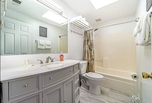 Combined shower/tub, hair dryer, towels, soap