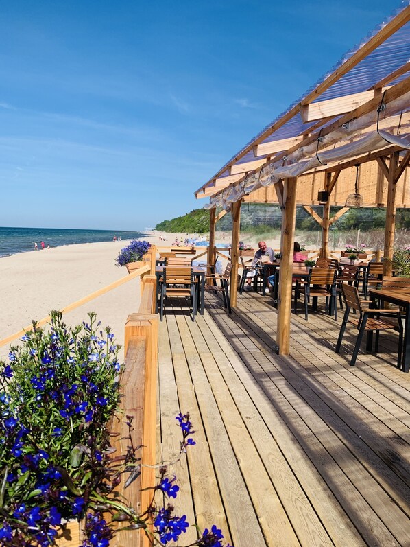 On the beach, sun-loungers