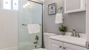 Bathtub, hair dryer, towels