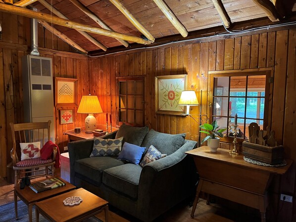 Interior - Quaint and cozy log and knotty pine cabin close to lakes. (Harrison)