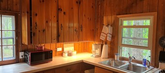 Quaint and cozy log  and knotty pine cabin close to lakes.