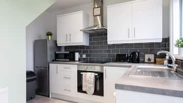 Casa, baño privado, vista a la ciudad | Cocina compartida