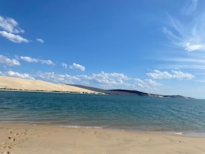 A beach with clear skies and calm waters.