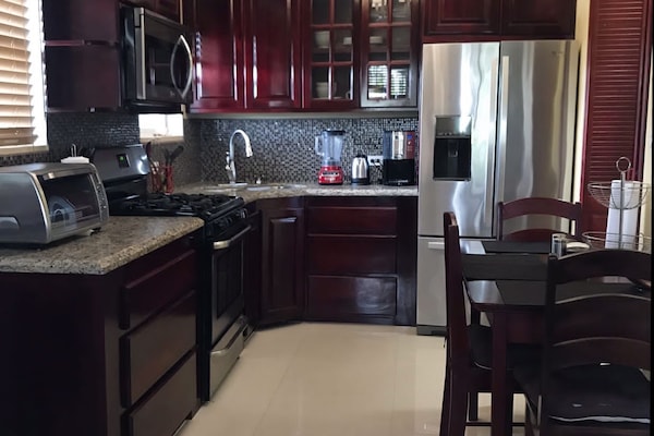 Executive Suite | Private kitchen | Coffee/tea maker, oven, electric kettle, cookware/dishes/utensils