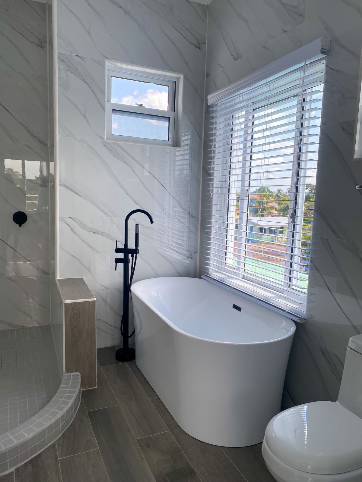 Plush Skyview Penthouse | Bathroom | Shower, hydromassage showerhead, hair dryer