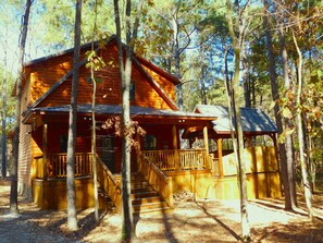 Exterior - This luxury two-bedroom luxury log cabin is designed and furnished in true rustic elegance. You will love the beautiful hand-scraped hardwood floors, giant hand-hewn dark oak beam accents to the knotty pine walls, granite counters, ceiling fans, stai (Broken Bow)