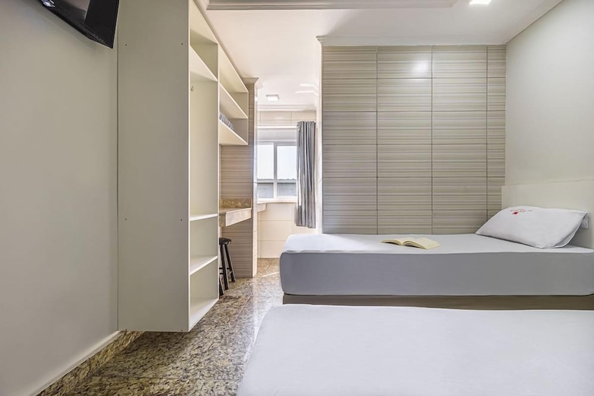 Desk, blackout drapes, bed sheets