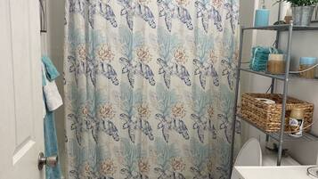 Combined shower/bathtub, hair dryer, towels, soap