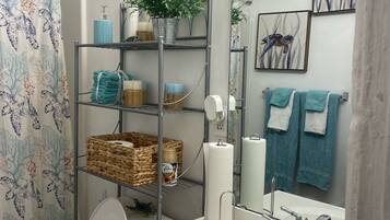 Combined shower/tub, hair dryer, towels, soap