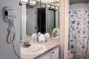 Combined shower/tub, jetted tub, rainfall showerhead, hair dryer