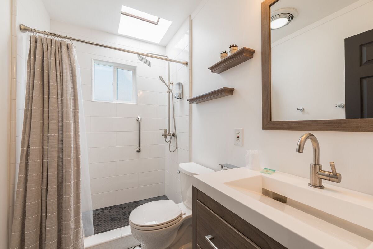 room 11 - king one bedroom suite | bathroom | hair dryer, towels