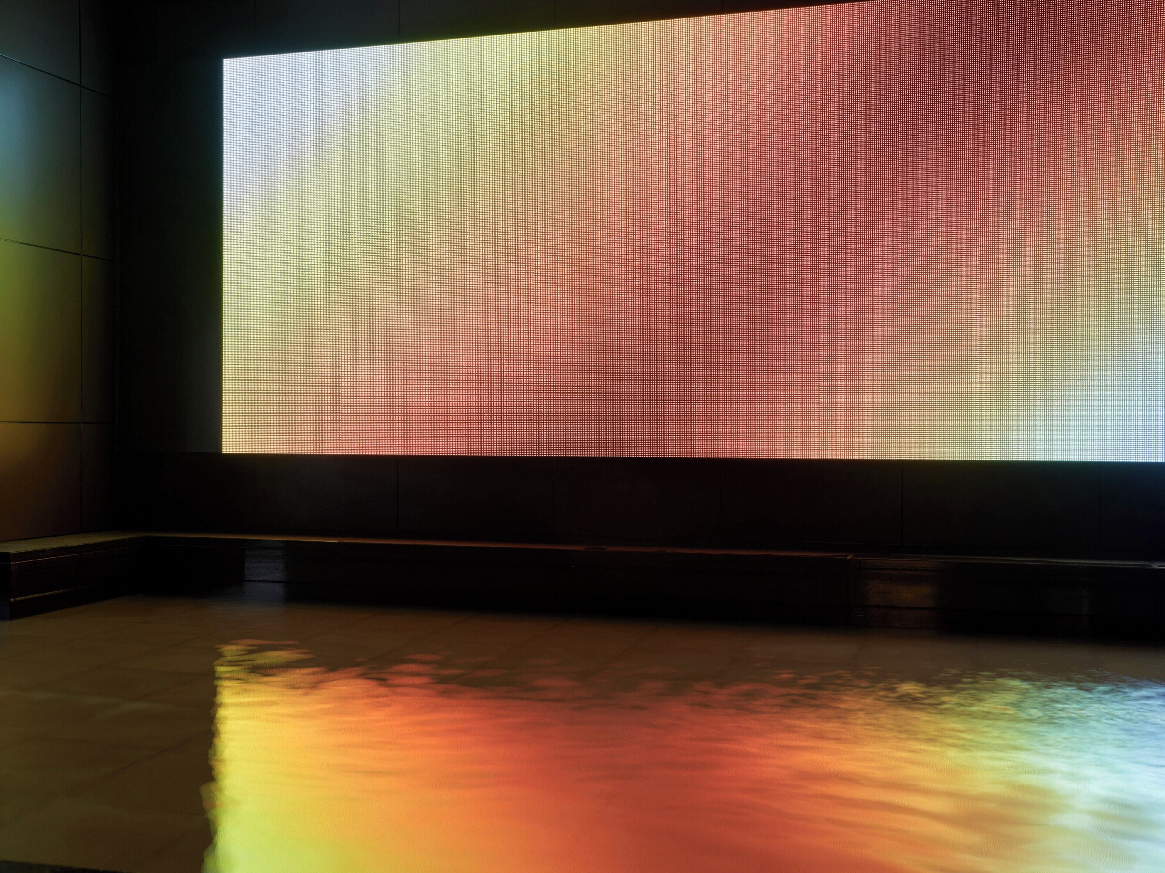 A large digital display with a gradient pattern.