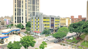 A multi-story building with a modern design, featuring a mix of glass and concrete facades. - Hub Hotel - Banqiao Station (New Taipei City)