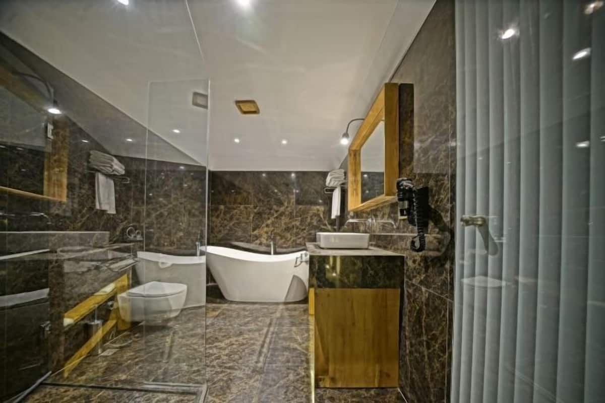 Bathroom | Designer toiletries, hair dryer, bathrobes, slippers