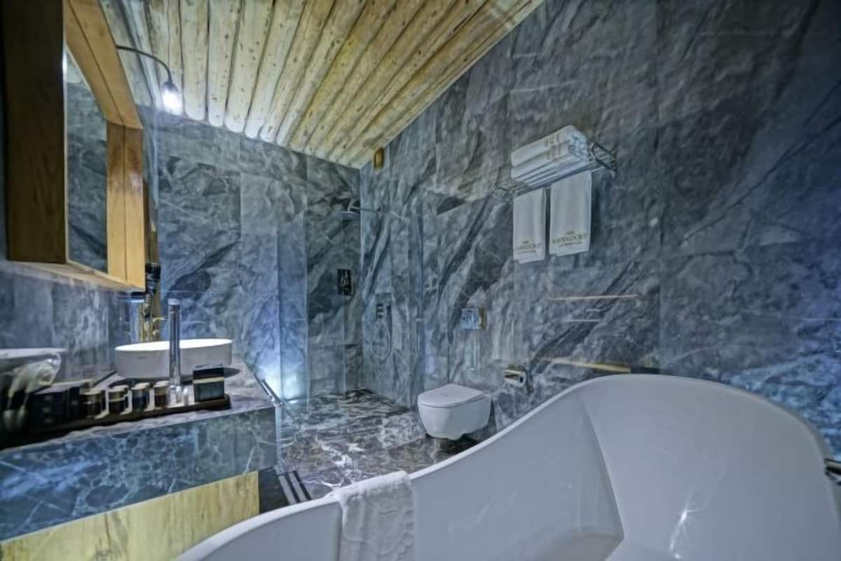 Bathroom | Designer toiletries, hair dryer, bathrobes, slippers