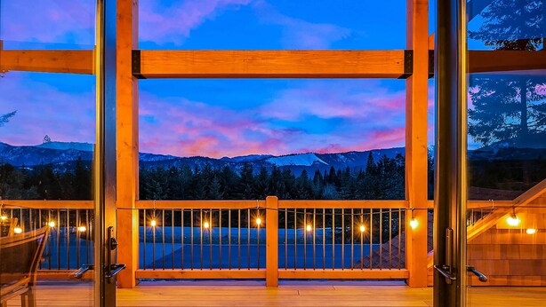 A wooden deck with a railing, a bench, and a view of a mountainous landscape. - Pool Access: Cle Elum Mtn-View Cabin w/ Game Room (Cle Elum)