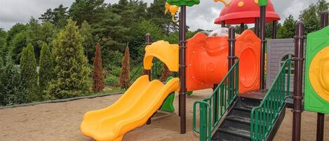 A playground with slides and climbing structures.