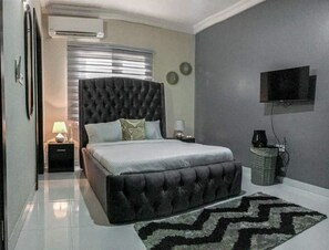 Apartamento, 2 camas Queen | 2 quartos, ferros/tábuas de passar roupa, Wi-Fi de cortesia