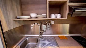 Habitació quàdruple familiar | Cuina bàsica privada | Frigorífic petit i placa de cuina