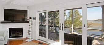 As you enter, the Bald Head Creek and marsh vistas-through the walls of windows-catch your eye.