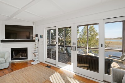 As you enter, the Bald Head Creek and marsh vistas-through the walls of windows-catch your eye.