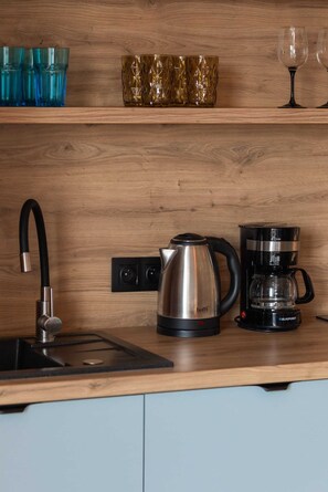 Fridge, stovetop, coffee/tea maker, cookware/dishes/utensils