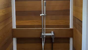 Combined shower/bathtub, towels, soap, toilet paper