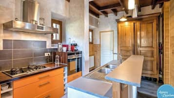 Fridge, oven, toaster, dining tables
