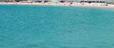 On the beach, sun loungers