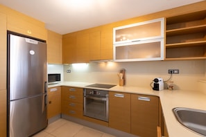 Coffee/tea maker, fridge, microwave, oven