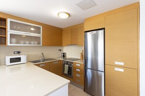 Coffee/tea maker, fridge, microwave, oven