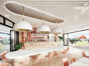 A modern bar area with a long counter, multiple hanging pendant lights, and a view of the outdoors. - The Star Residences Gold Coast (Gold Coast)
