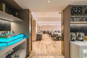 A modern kitchen with wooden cabinetry, a marble countertop, and a built-in coffee station. - Echarm Plus Hotel Xi'an Hancheng Lake Shirong International (Xi'an)