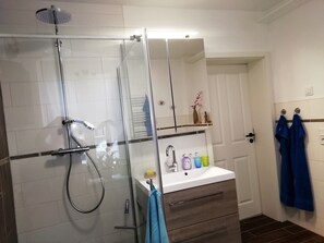 Shower, hair dryer, towels, soap