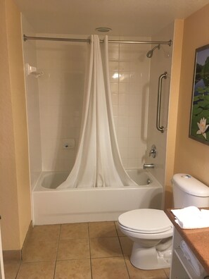 Bathtub, towels, soap, shampoo