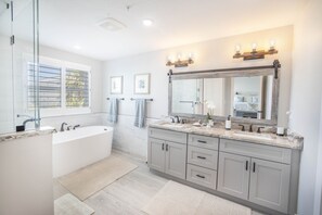 Bathtub, hair dryer, towels, soap