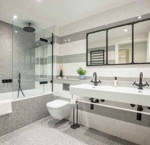 Combined shower/tub, hair dryer, towels, soap