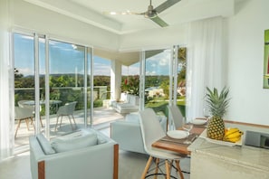 Exclusive Villa, 1 King Bed, Ocean View, Poolside | Living area | 43-inch Smart TV with satellite channels