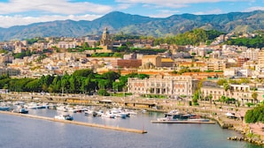 A coastal cityscape with a marina, historic buildings, and a mountain backdrop. - Villa Olmo With Private Pool (Castel di Lucio)