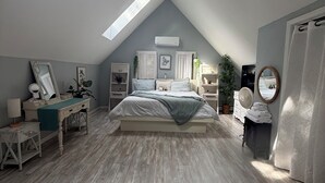A bedroom with a sloped ceiling, a bed, a desk, and a chair. - Spacious family sized beach home - 15 minute walk to beach! (Old Orchard Beach)