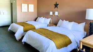 A hotel room with two beds, a star decoration on the wall, and two bedside lamps. - The Benson Motel - Benson, MN - US-12 HWY (Benson)